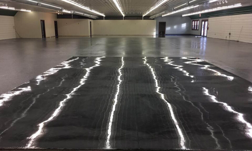 High-gloss black epoxy coating applied in a large industrial facility installed by Epoxy Pro Coatings