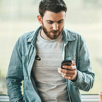 Man scheduling epoxy floor consultation on his phone
